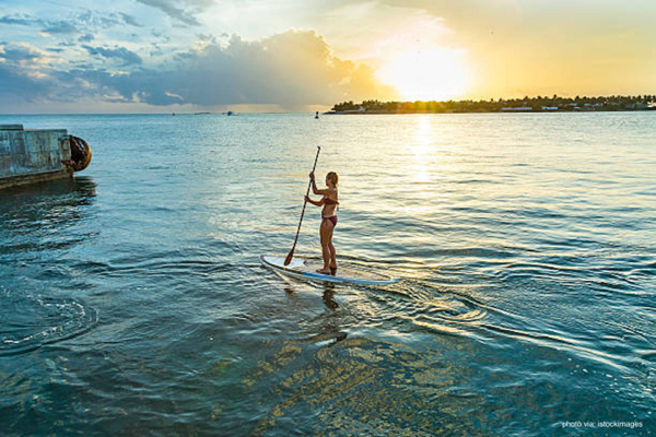 Woman Paddleboarding in Key West ocean